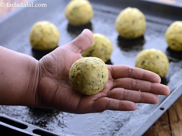 Step 28 – Take a portion of dough and stretch the top of the dough while pinching and …