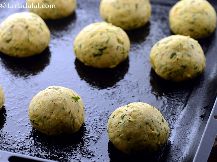 Step 29 – Place it on the greased baking tray. Space the rolls about &frac12; to 1 inch …