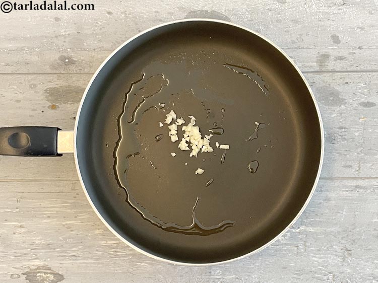 Step 23 – Add&nbsp;<meta charset="UTF-8" />2 tsp&nbsp;finely&nbsp;<a href="glossary-chopped-garlic-790i">chopped garlic (lehsun)</a>.