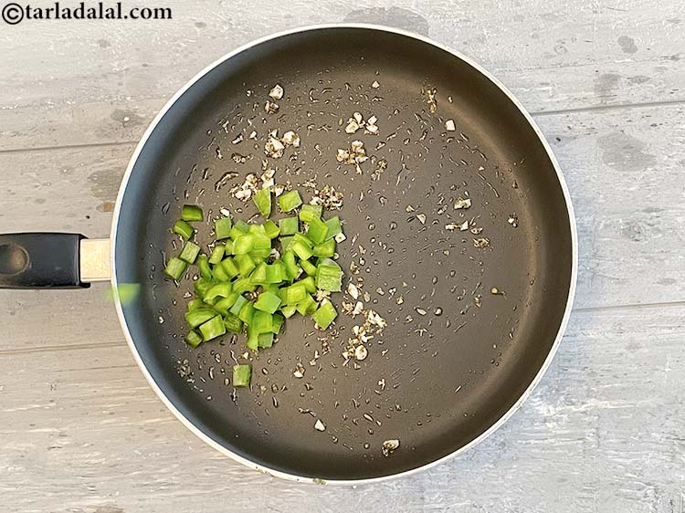 Step 26 – Add&nbsp;<meta charset="UTF-8" />1/4 cup&nbsp;<a href="glossary-chopped-capsicum-164i">chopped capsicum</a>.&nbsp;Rich in&nbsp;<a href="https://www.tarladalal.com/recipes-for-Vitamin-C-Rich-Indian-Recipes-804">vitamin C</a>,&nbsp;capsicum&nbsp;protect and maintain the lining of the …