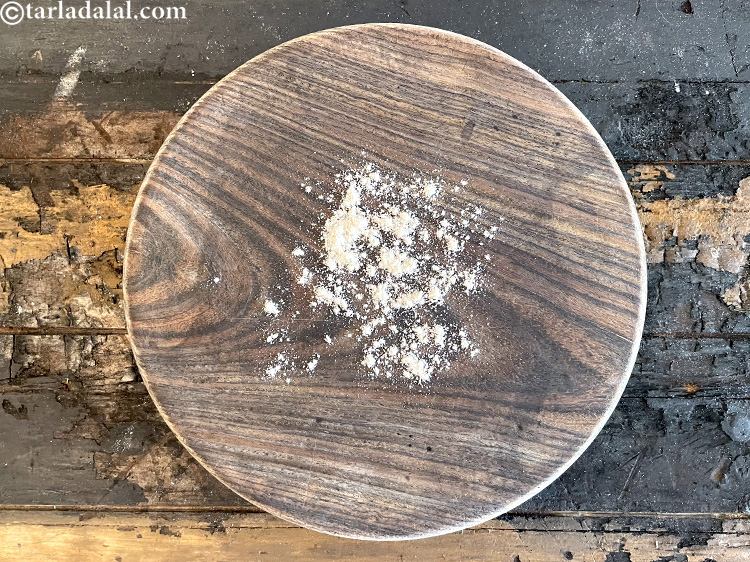 Step 23 – Dust a rolling board with some whole wheat flour.