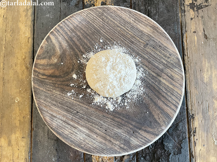 Step 24 – Flatten the dough and put some whole wheat flour over it.