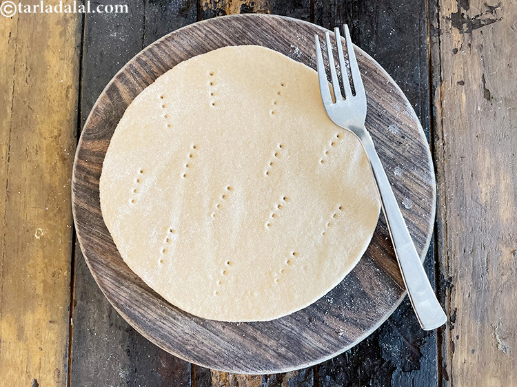 Step 26 – Prick each circle evenly using a fork.