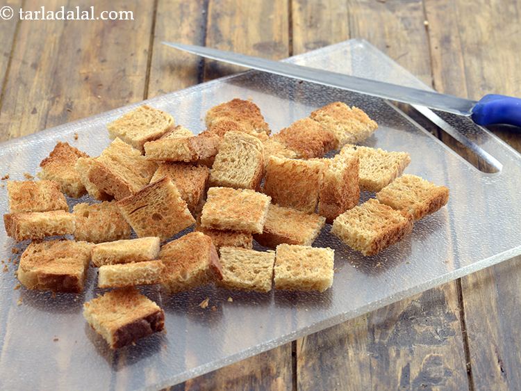 Step 5 – Cut each toasted bread slice into 9 cubes using a sharp knife.