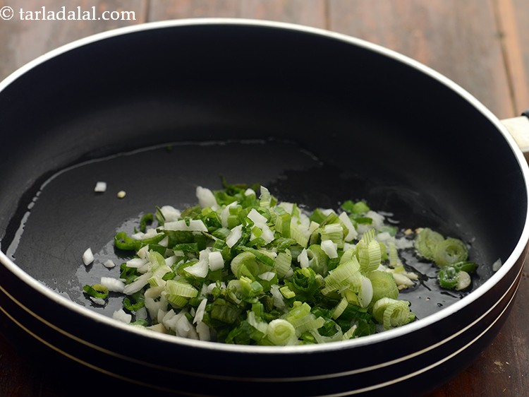 Step 11 – Add spring onion whites and greens.