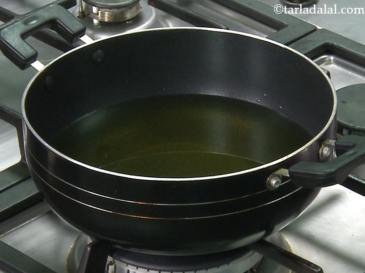 Step 4 – For preparing the <strong>Yellow Banana Chips</strong>, heat the oil in a deep non-stick pan on …