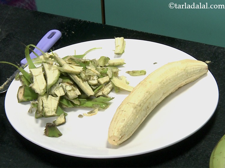 Step 6 – Trim both the edges of the raw banana and gently remove the peel using your …