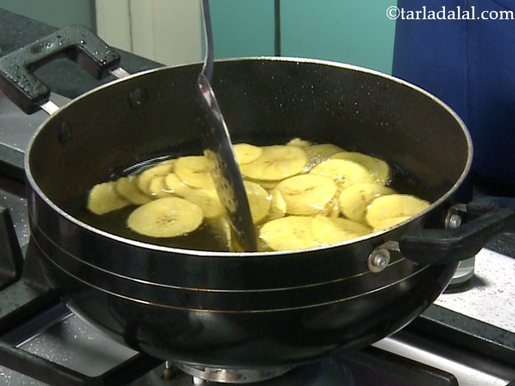 Step 12 – Continue cooking the chips on a medium flame till they turn crisp from both sides …