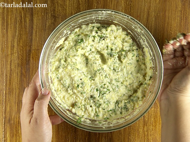 Step 23 – Mix well and your <strong>Yellow Moong and Urad Dal Pakoda</strong> mixture is ready.