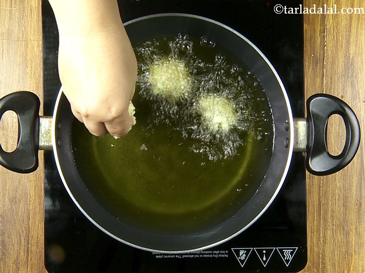 Step 25 – Once the oil is hot, drop spoonful of the mixture using your fingers. Be careful …