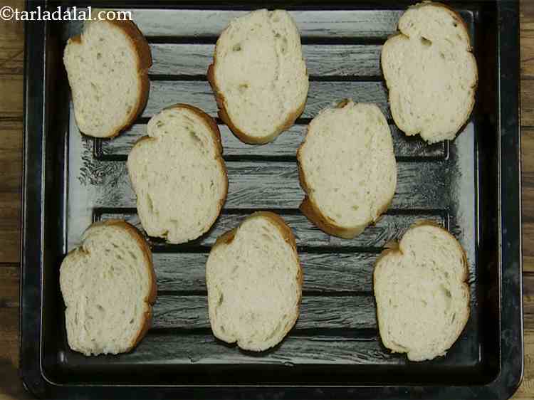 Step 13 – Arrange the bread slices on the greased baking tray.