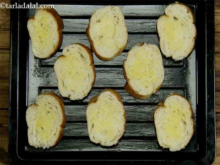 Step 14 – Brush all the bread slices with melted butter. This will give a superb taste to …