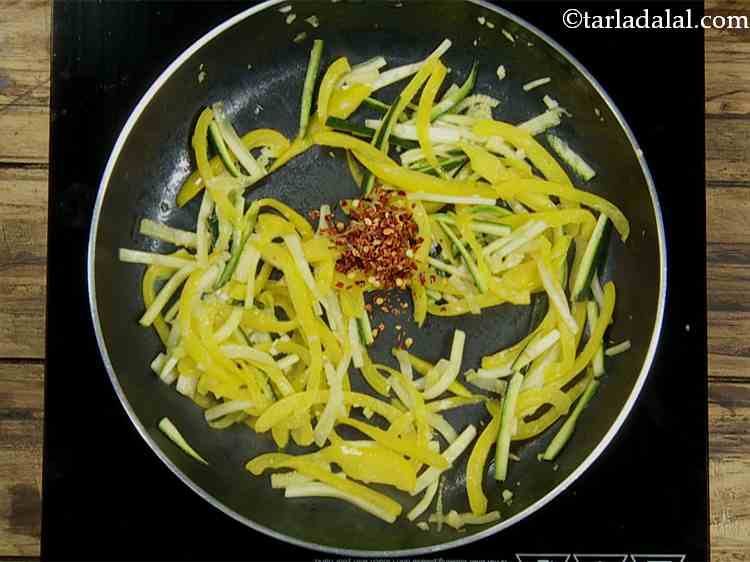 Step 5 – Then add the chilli flakes for a spicy taste.