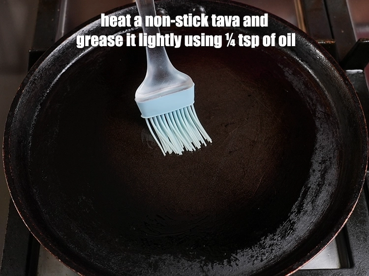 Step 9 – <p>Heat a non-stick tava (griddle) and grease it lightly using ¼ tsp of oil.</p>