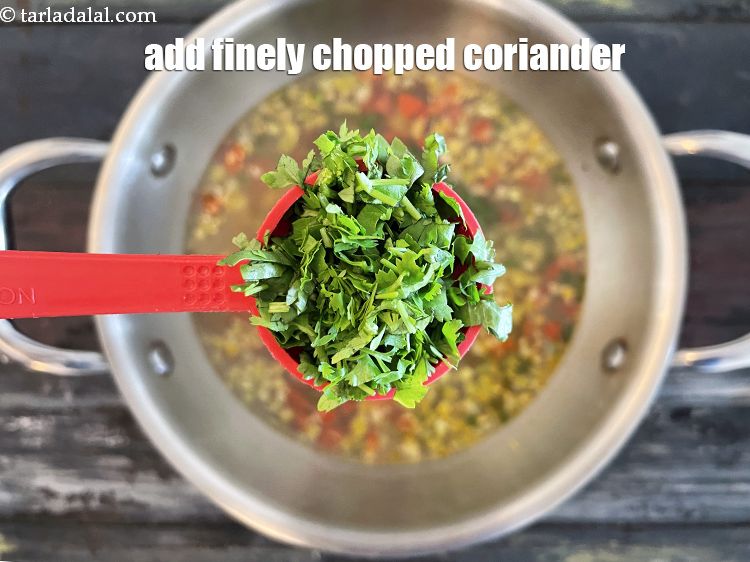 Step 20 – <p>Add 2 tbsp&nbsp;finely&nbsp;<a href="glossary-coriander-dhania-kothmir-369i">coriander (dhania)</a>, it would give a luscious taste to the&nbsp;<strong>Mixed Vegetable Clear …
