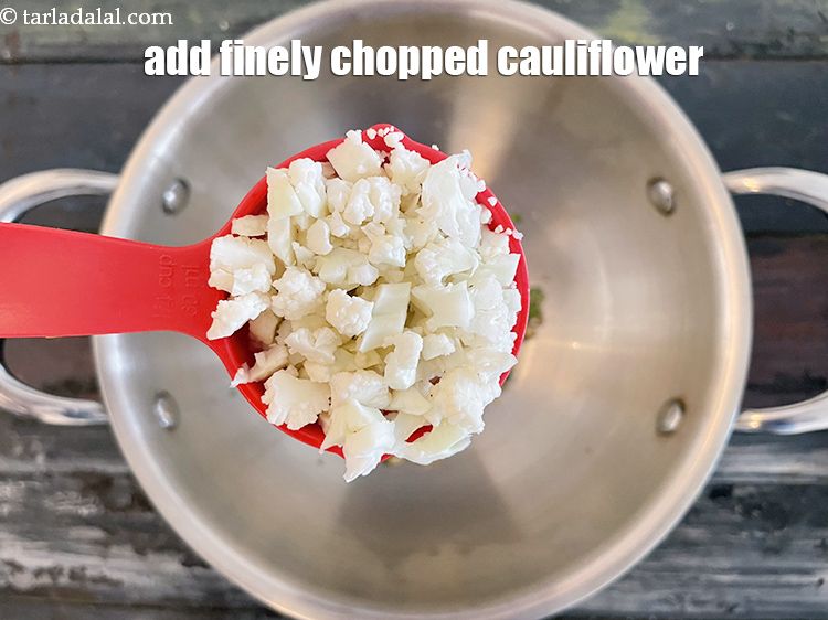 Step 9 – <p>Add 1/4 cup&nbsp;finely&nbsp;<a href="glossary-chopped-cauliflower-796i">chopped cauliflower</a>. Instead of chopping you can also use grated cauliflower.</p>