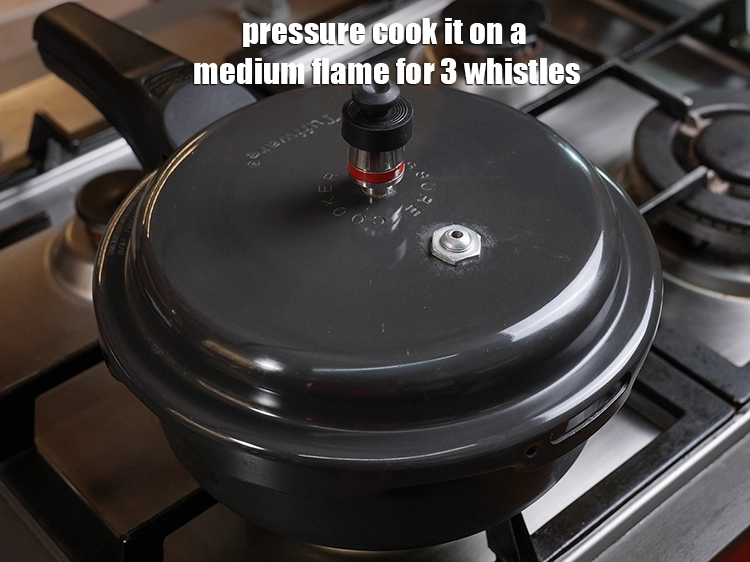 Step 7 – <p>Pressure cook it on a medium flame for 3 whistles.</p>