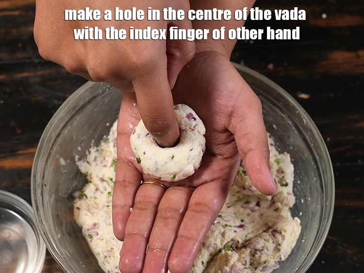 Step 21 – <p><span style="background-color:rgb(255,255,255);color:rgb(0,0,0);">Make a hole in the centre of the vada with the index finger of …