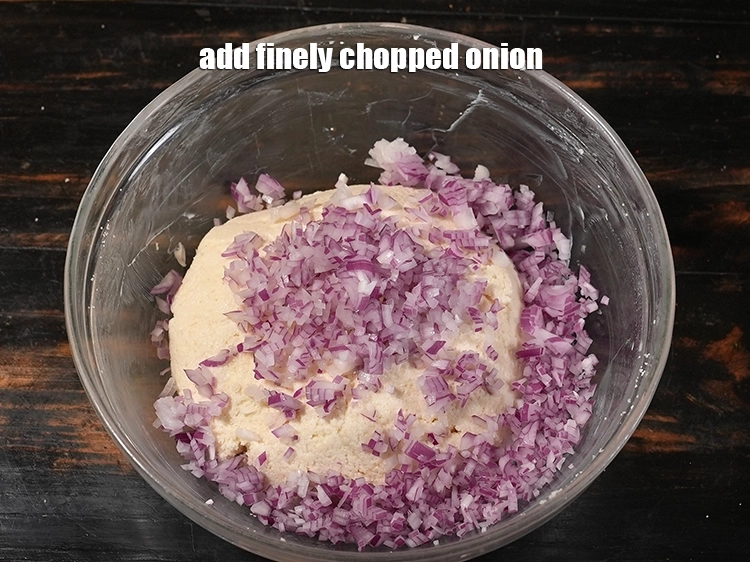Step 5 – <p>Add more flavour and texture to the <strong>instant sooji vada</strong>. First add 1/2 cup&nbsp;finely&nbsp;<a href="https://www.tarladalal.com/glossary-chopped-onions-722i">chopped …