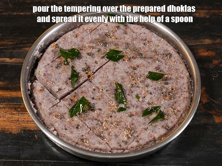 Step 20 – <p><span style="background-color:rgb(255,255,255);color:rgb(0,0,0);">Pour the tempering over the prepared dhoklas and spread it evenly with the help …