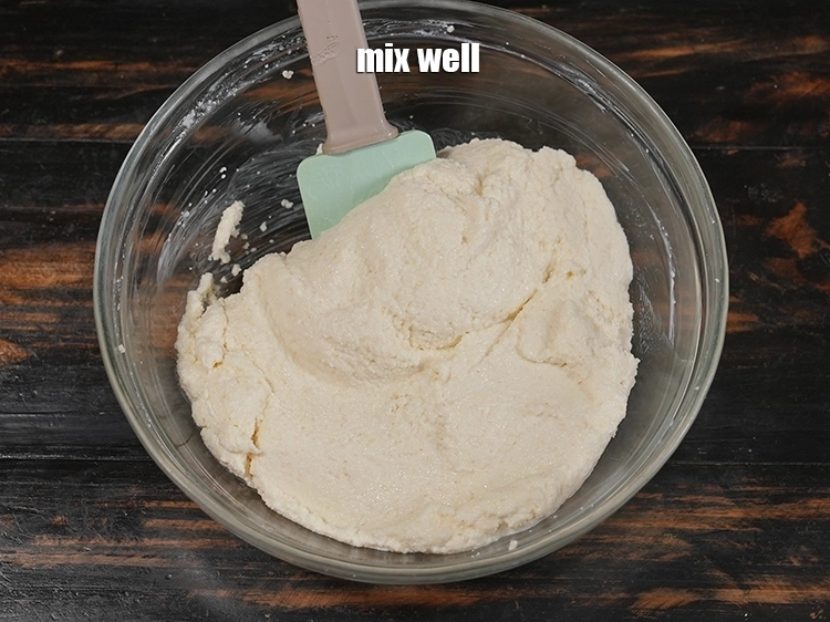 Step 6 – <p><span style="background-color:rgb(255,255,255);color:rgb(0,0,0);">Mix well and form a batter for making the </span><strong>rava bonda.</strong></p>