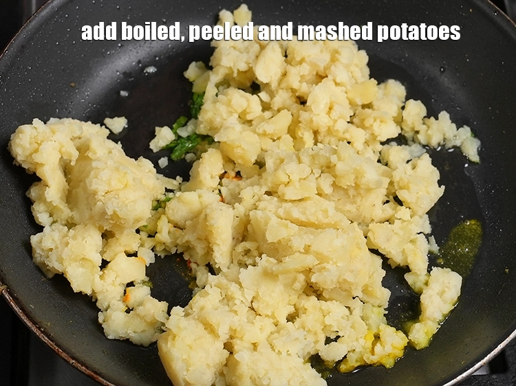 Step 21 – <p><span style="background-color:rgb(255,255,255);color:rgb(0,0,0);">Add 2 cups&nbsp;</span><a href="https://www.tarladalal.com/glossary-boiled-and-mashed-potatoes-1831i">boiled , peeled and mashed potatoes</a><span style="background-color:rgb(255,255,255);color:rgb(0,0,0);">.</span></p>