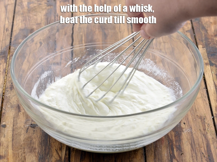 Step 2 – <p>With the help of a whisk, beat the curd till smooth. Beating adds volume to …