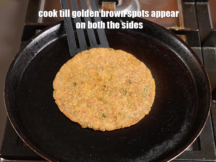 Step 23 – <p>Cook till golden brown spots appear on both the sides.</p>