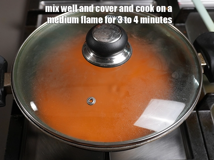 Step 35 – <p>Mix well and cover and cook on a medium flame for 3 to 4 minutes, …