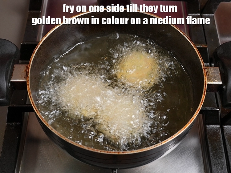 Step 31 – <p>Fry on one side till they turn golden brown in colour on a medium flame. …