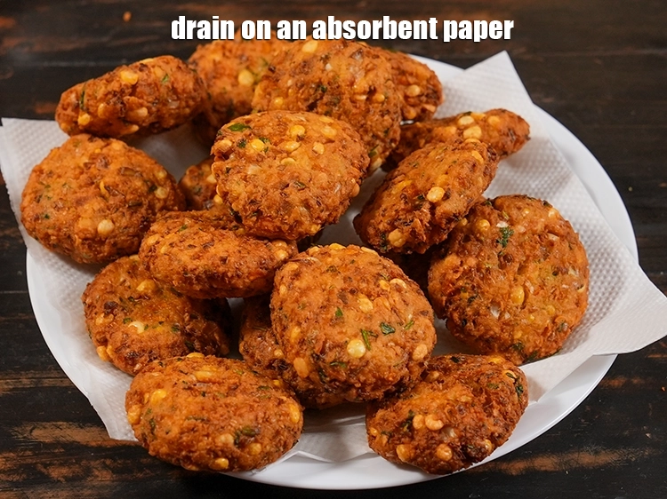 Step 25 – <p><span style="background-color:rgb(255,255,255);color:rgb(0,0,0);">Drain the </span><strong>cabbage vadai</strong><span style="background-color:rgb(255,255,255);color:rgb(0,0,0);"> on an absorbent paper. Alternatively, you can even shallow …