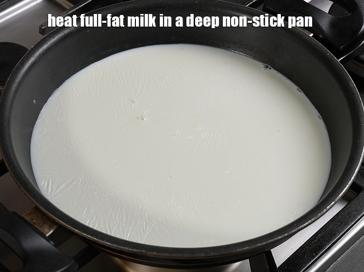 Step 3 – <p>Heat <span style="background-color:rgb(255,255,255);color:rgb(0,0,0);">4 cups full fat </span><a href="https://www.tarladalal.in/glossary-milk-doodh-full-cream-milk-514i"><u>milk</u></a> in a deep non-stick pan.</p>