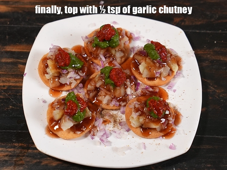 Step 10 – <p><span style="background-color:rgb(255,255,255);color:rgb(0,0,0);">Finally, top with ½ tsp of </span><a href="https://www.tarladalal.com/Lehsun-ki-Chutney-Lasun-Ki-Chutney-Garlic-Chutney-for-Chaat-3902r"><u>garlic chutney</u></a><span style="background-color:rgb(255,255,255);color:rgb(0,0,0);">. The quantity of all …