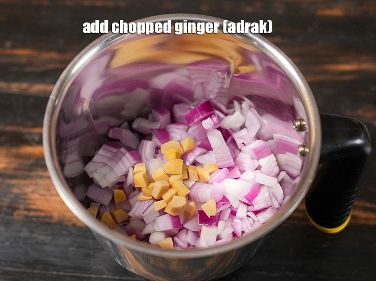 Step 14 – <p>To this add <span style="background-color:rgb(255,255,255);color:rgb(0,0,0);">1 tbsp </span><a href="https://www.tarladalal.in/glossary-ginger-adrak-453i#ing_2366"><u>chopped ginger (adrak)</u></a>.</p>
