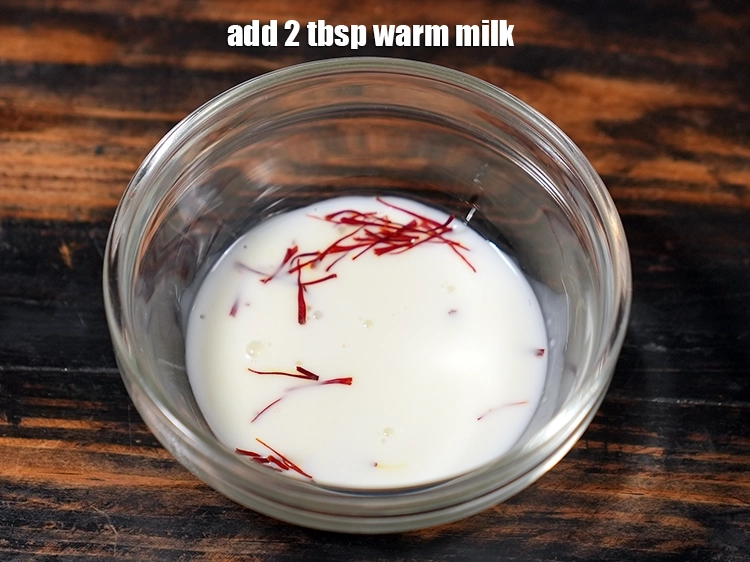 Step 19 – <p>Add <span style="background-color:rgb(255,255,255);color:rgb(0,0,0);">2 tbsp warm </span><a href="https://www.tarladalal.in/glossary-milk-doodh-full-cream-milk-514i"><u>milk</u></a><u>.</u></p>