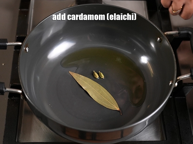 Step 23 – <p><span style="background-color:rgb(255,255,255);color:rgb(0,0,0);">Also, add the 2 </span><a href="https://www.tarladalal.in/glossary-cardamom-elaichi-262i"><u>cardamom (elaichi)</u></a><span style="background-color:rgb(255,255,255);color:rgb(0,0,0);"> and sauté on a medium flame …