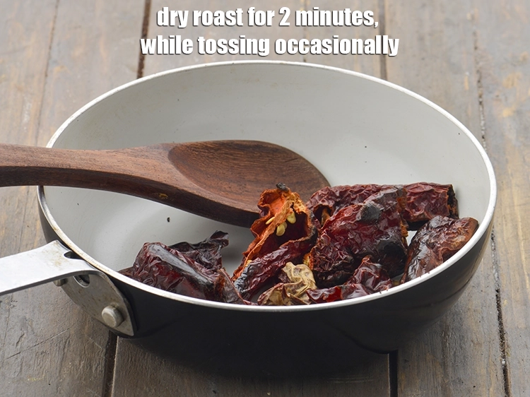 Step 6 – <p>Dry roast for 2 minutes, while tossing occasionally. Keep the roasted chillies aside.</p>