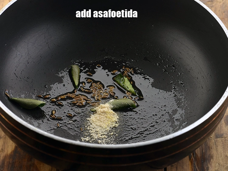 Step 11 – <p>Now, add asafoetida for providing your nourishing moong soup with the desired amount of pungency.</p>