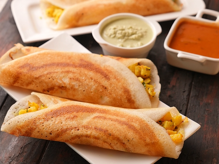 Step 29 – <p>Repeat with the remaining ingredients to make 3 more <strong>masala dosas</strong>.</p>