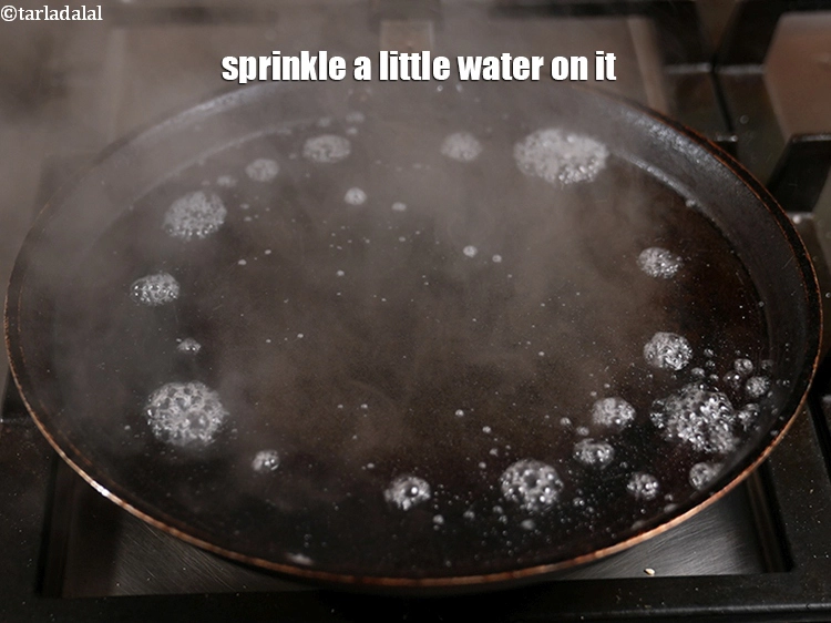 Step 33 – <p><span style="background-color:rgb(255,255,255);color:rgb(0,0,0);">Greasing of the tava and then sprinkling water, is very important as it brings …