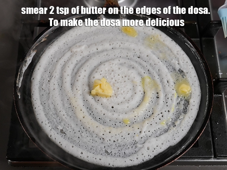 Step 26 – <p>Smear 2 tsp of butter on the edges of the <strong>dosa</strong>. To make the dosa …