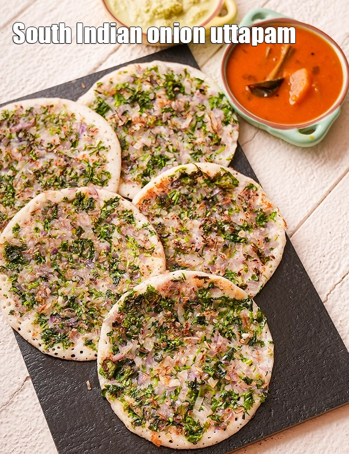 Step 46 – <p>Serve the&nbsp;<strong>Onion Uttapas</strong>&nbsp;immediately with sambhar, coconut chutney and green garlic chutney.</p>