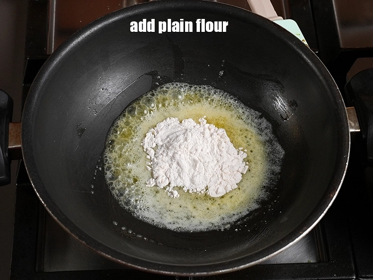 Step 16 – <p>Add 1½ tbsp of <a href="https://www.tarladalal.in/glossary-plain-flour-maida-188i"><u>plain flour (maida)</u></a>.</p>