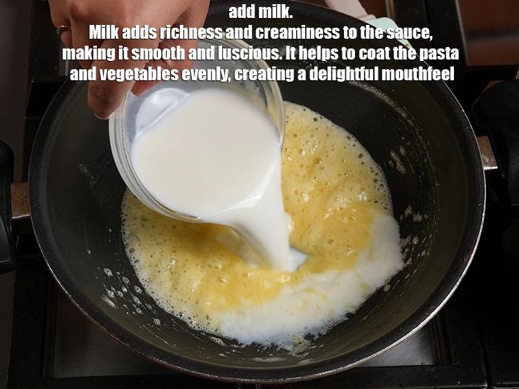 Step 18 – <p style="margin-left:0px;">Add 1½ cups of <a href="https://www.tarladalal.in/glossary-milk-doodh-full-cream-milk-514i"><u>milk</u></a>. Milk adds richness and creaminess to the sauce, …