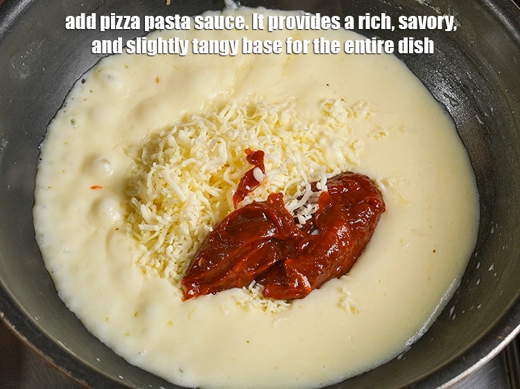 Step 21 – <p><span style="background-color:rgb(255,255,255);color:rgb(0,0,0);">Add ¼ cup </span><a href="https://www.tarladalal.in/glossary-Pizza-sauce-1889i"><u>Pizza sauce</u></a><span style="background-color:rgb(255,255,255);color:rgb(0,0,0);">. It provides a rich, savory, and slightly …