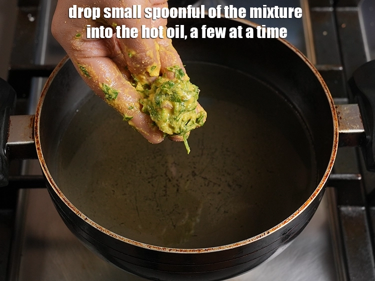 Step 13 – <p>Drop small spoonful of the mixture into the hot oil, a few at a time.</p>