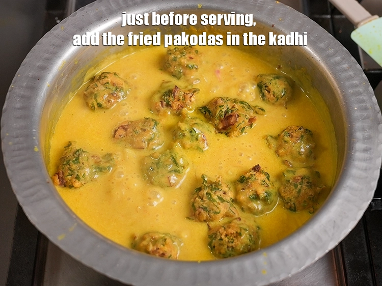 Step 37 – <p>Just before serving, add the fried pakodas in the kadhi.</p>
