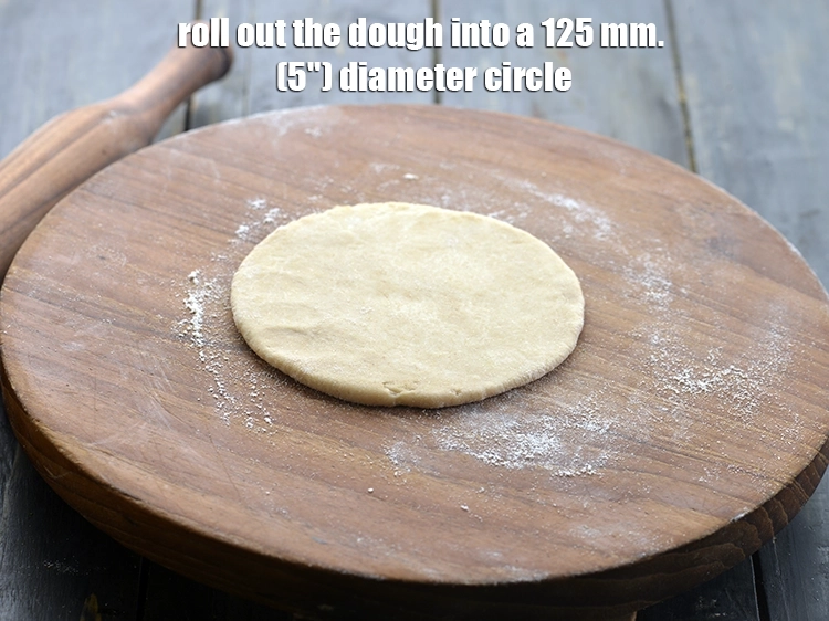 Step 21 – <p>Roll out the dough into a 125 mm. (5") diameter circle using a little whole …