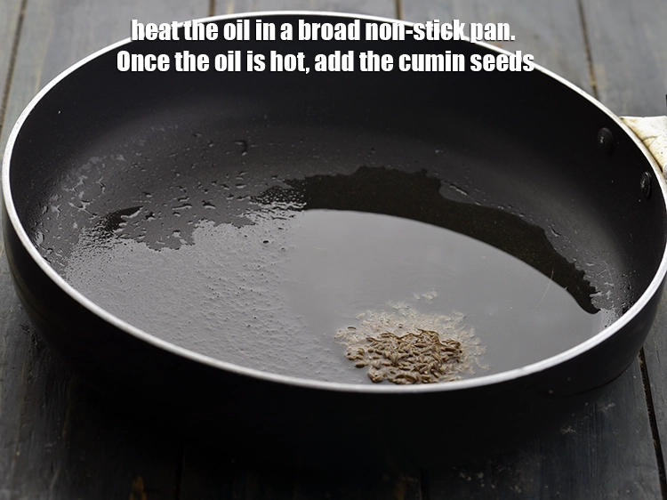 Step 10 – <p>To begin making the <strong>aloo methi parathas</strong>, heat the oil in a broad non-stick pan. …