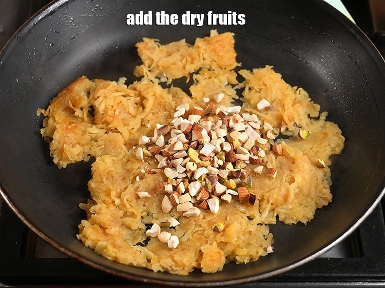 Step 6 – <p>Add <span style="background-color:rgb(255,255,255);color:rgb(0,0,0);">1/4 cup </span><a href="https://www.tarladalal.in/glossary-mixed-nuts-927i#ing_3253"><u>chopped mixed nuts </u></a><span style="background-color:rgb(255,255,255);color:rgb(0,0,0);">( almonds, cashews, pista).</span></p>